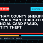 Symbolic editorial breaking-check graphic for Chatham County Sheriff: New York Man Charged with Financial Card Fraud, Identity Theft, not a depiction of the event.