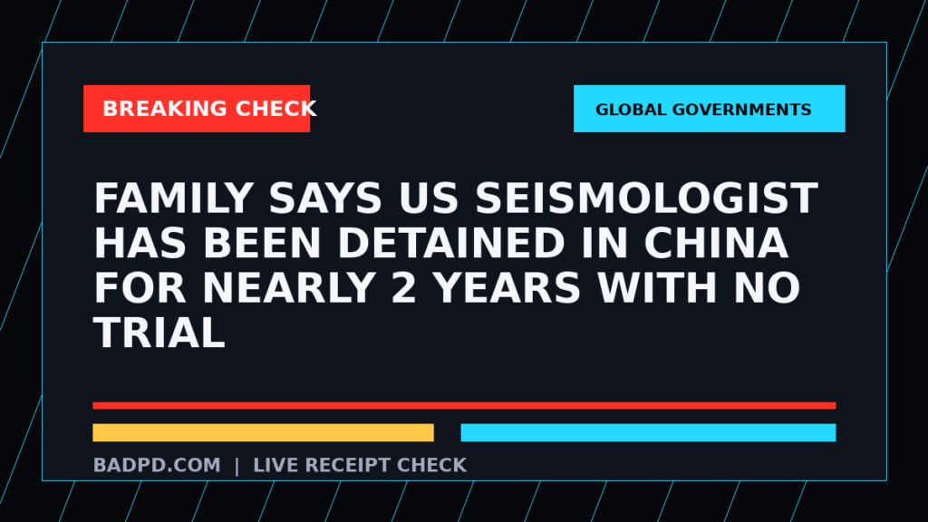 Symbolic editorial breaking-check graphic for Family says US seismologist has been detained in China for nearly 2 years with no trial, not a depiction of the event.