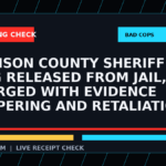 Symbolic editorial breaking-check graphic for Johnson County Sheriff Adam King released from jail, charged with evidence tampering and retaliation, not a depiction of the event.