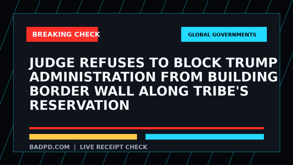Symbolic editorial breaking-check graphic for Judge refuses to block Trump administration from building border wall along tribe's reservation, not a depiction of the event.